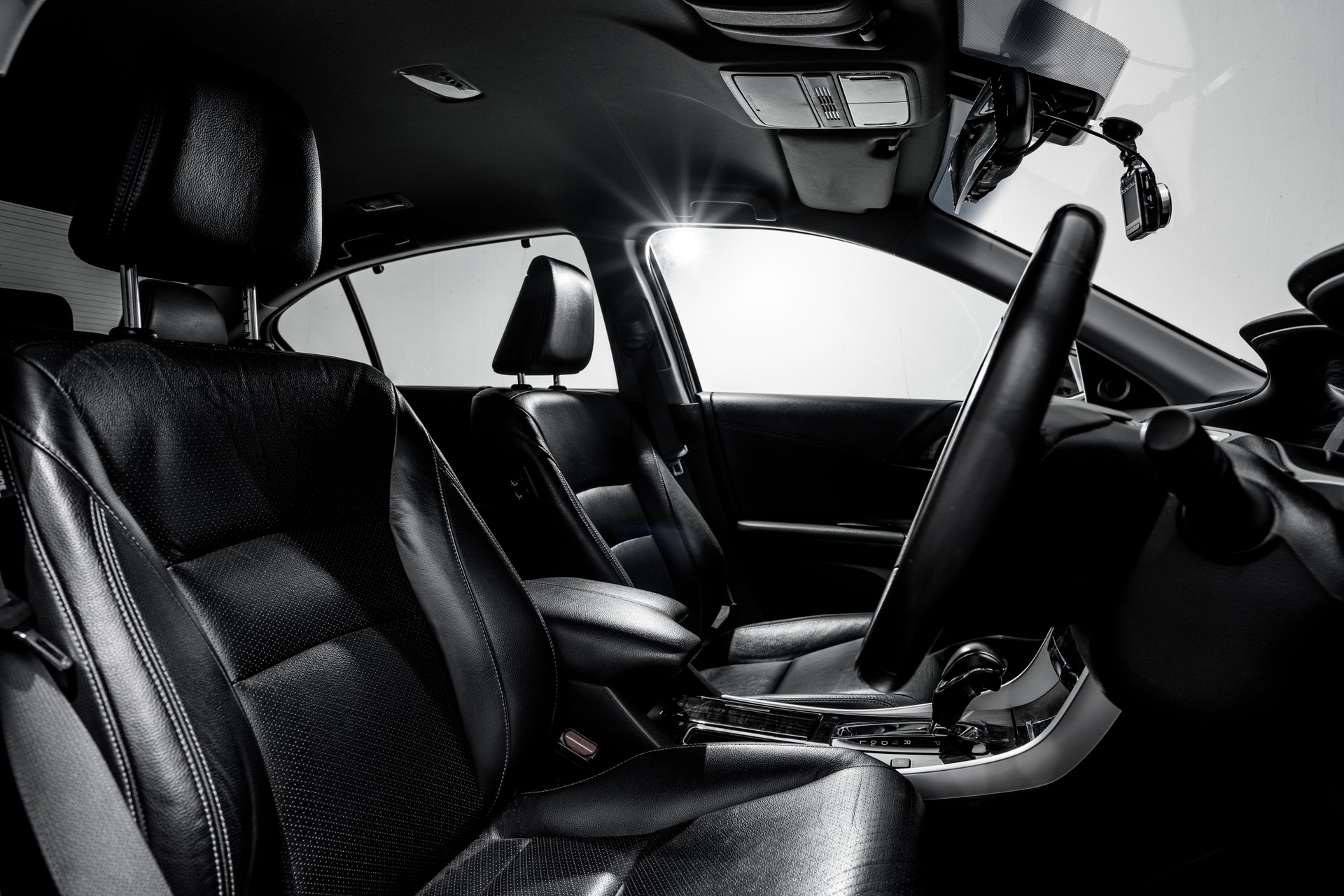 Clean console modern car, black indoor design.